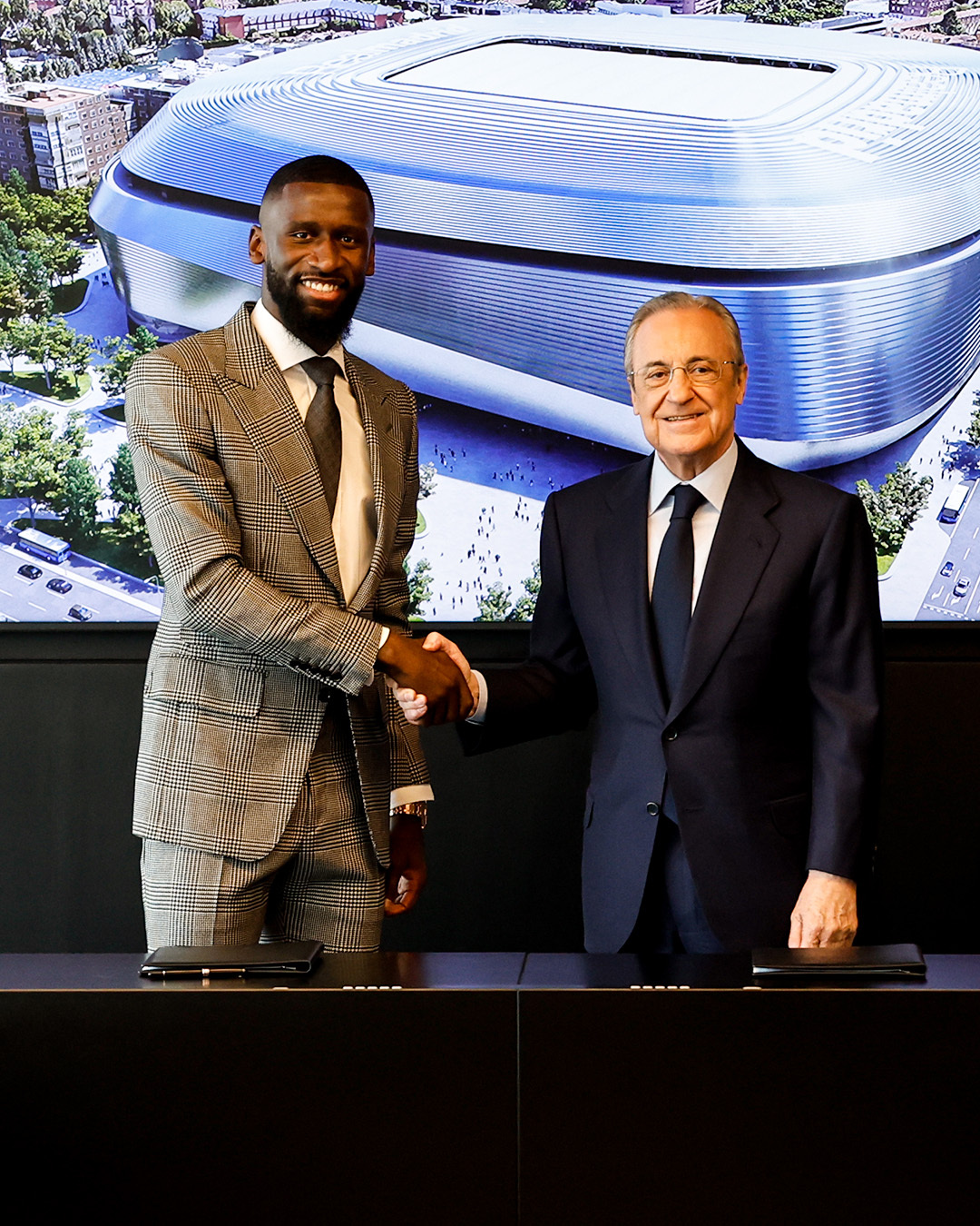 May be an image of 2 people, people standing, suit and indoor