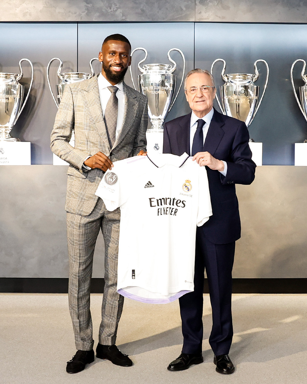 May be an image of 2 people, people standing, indoor and text that says 'ท adidas Emrates FLYETER'